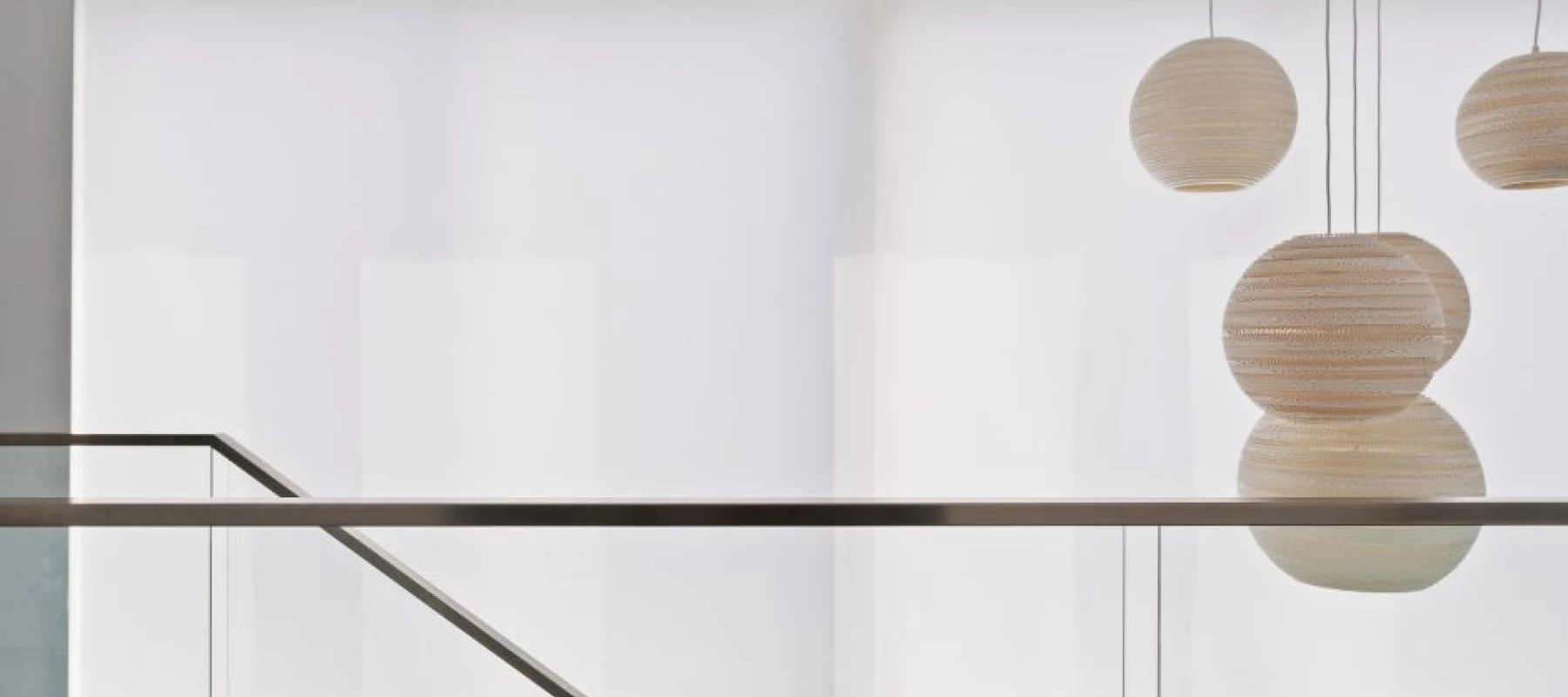 White roller blinds over upstairs window