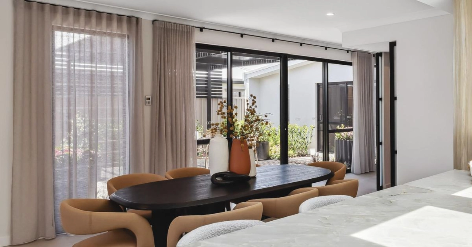 Curtains framing indoor outdoor living areas