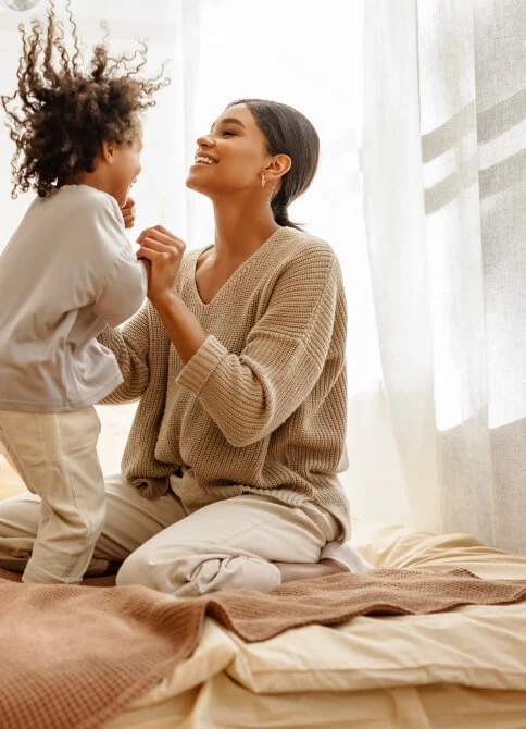 Family enjoying room with sheer curtains