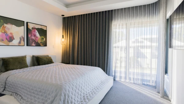 Dark blockout bedroom curtains paired with Sheers