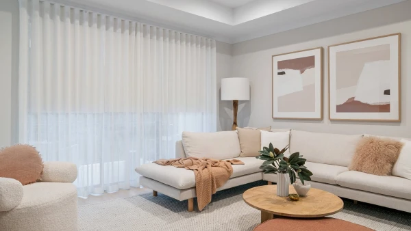 Sheer curtains hanging in a modern living room with natural light.